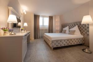Postel nebo postele na pokoji v ubytování Hotel Casa Fiori