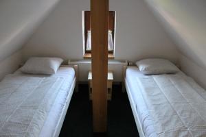 Posteľ alebo postele v izbe v ubytovaní Vila Kokrhačka