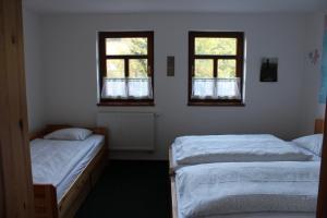 Posteľ alebo postele v izbe v ubytovaní Vila Kokrhačka
