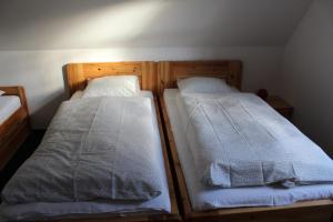 Posteľ alebo postele v izbe v ubytovaní Vila Kokrhačka