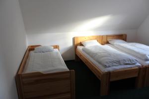 Posteľ alebo postele v izbe v ubytovaní Vila Kokrhačka
