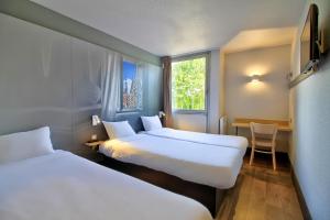 Postel nebo postele na pokoji v ubytování B&B HOTEL Beaune Sud 1 Palais des Congrès