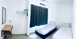 Una cama o camas en una habitación de LunaStay (Shared Common Area)