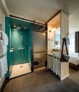 a bathroom with a shower, sink, and toilet at Marias Platzl in Munich
