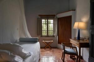 Ένα ή περισσότερα κρεβάτια σε δωμάτιο στο Borgo Lucignanello Bandini