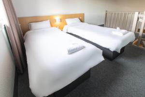 Ein Bett oder Betten in einem Zimmer der Unterkunft B&B HOTEL Saint-Malo Centre