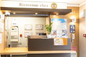 Ein Zertifikat, Auszeichnung, Logo oder anderes Dokument, das in der Unterkunft B&B HOTEL Saint-Malo Centre ausgestellt ist