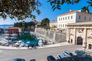 a view of a marina with boats in the water at Apartments Kalelarga in Zadar