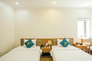 Katil atau katil-katil dalam bilik di White Crown Hotel