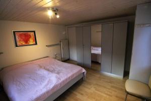 Ein Bett oder Betten in einem Zimmer der Unterkunft Heimathüs