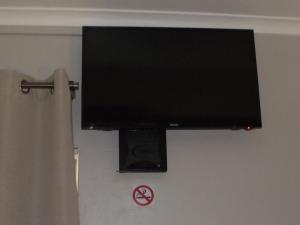TV a/nebo společenská místnost v ubytování De Nachtuilen Guesthouse