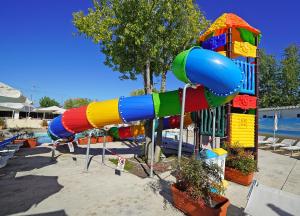 a colorful water slide in a park at Butterfly Camping Village in Peschiera del Garda