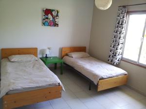 A bed or beds in a room at Los Guanches Bungalows