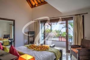 Lova arba lovos apgyvendinimo įstaigoje Vila Ultima Bali