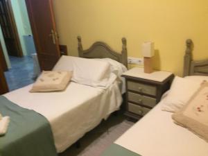 Cama o camas de una habitación en La Fusteria del Casat