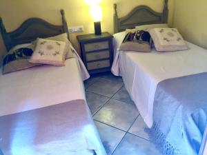 Cama o camas de una habitación en La Fusteria del Casat