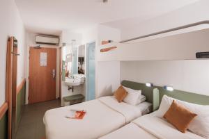 Postelja oz. postelje v sobi nastanitve MIA HOTELS Tanger