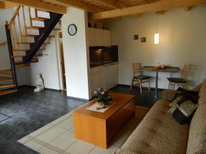 a living room with a couch and a table at Käsmu Merekalda Apartments - Adults only in Käsmu