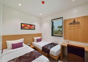 Postel nebo postele na pokoji v ubytování Hotel Leafio-Near Airport