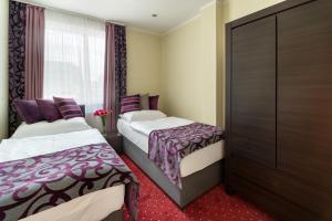 Postel nebo postele na pokoji v ubytování Hotel Na Vývoji