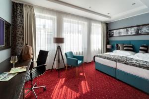 Postel nebo postele na pokoji v ubytování Hotel Na Vývoji