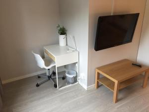 TV a/nebo společenská místnost v ubytování Vallabiten Rum och Lägenheter