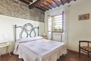 Ένα ή περισσότερα κρεβάτια σε δωμάτιο στο La Castagnara by Salogi Villas +24 φωτογραφίες