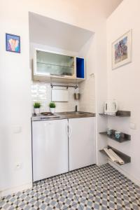 Kuchyňa alebo kuchynka v ubytovaní Rental Apartments Poznańska