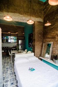 Ένα ή περισσότερα κρεβάτια σε δωμάτιο στο Moonshine Boutique Hostal