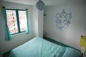 Postel nebo postele na pokoji v ubytování Hostal La Isla