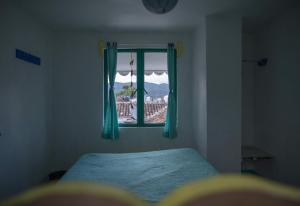 Postel nebo postele na pokoji v ubytování Hostal La Isla