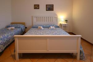 Postel nebo postele na pokoji v ubytování InGarda Rooms