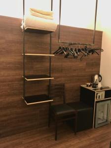 a room with a kitchen with a hanging rack at Hotel Principe di Piemonte in Rimini
