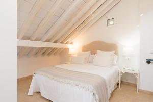 Cama o camas de una habitación en Loft con gran terraza en primera linea de playa