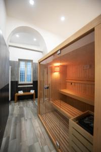 a bathroom with a shower and a bench in a room at Hermes rooms for tourists in Naples