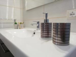 a bathroom counter with a sink and a faucet at La Casetta in Mortola Inferiore +42 photos