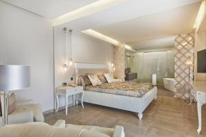 Posteľ alebo postele v izbe v ubytovaní Boutiquehotel El Coto