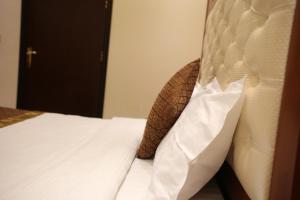 Una cama o camas en una habitación de Beauty Rayan 2