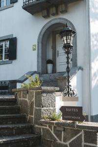 a street light on the side of a building at 4U Lisbon Airport Suites in Lisbon