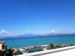 a view of a harbor with boats in the water at Hotel Fornaci in Peschiera del Garda