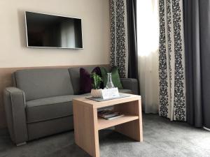 Telewizja i/lub zestaw kina domowego w obiekcie Olympia-Relax-Hotel Leonhard Stock