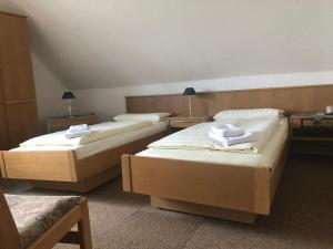 Postel nebo postele na pokoji v ubytování Krügers Hotel