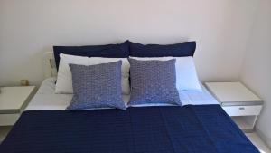 A bed or beds in a room at Apulia Beach