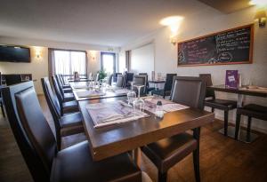 Posezení v ubytování Hôtel Inn Design Resto Novo Alençon