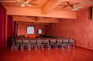 a conference room with a long table and chairs at Posada de la Mision, Hotel Museo y Jardin in Taxco de Alarcón