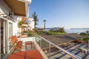 a balcony of a house with a view of the ocean at Nur Hotel in Kaş