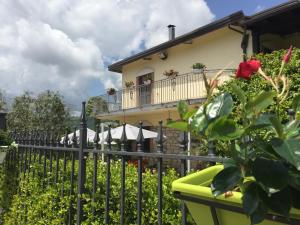 a woman on the balcony of a house at Masseria Frangiosa in Torrecuso