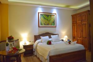Ένα ή περισσότερα κρεβάτια σε δωμάτιο στο El Gran Hotel de Pereira