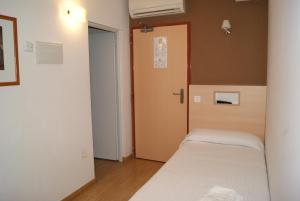 Postel nebo postele na pokoji v ubytování Hostal Sant Bernat