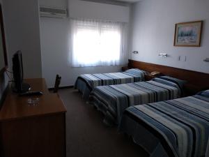 Postel nebo postele na pokoji v ubytování Hotel Crown